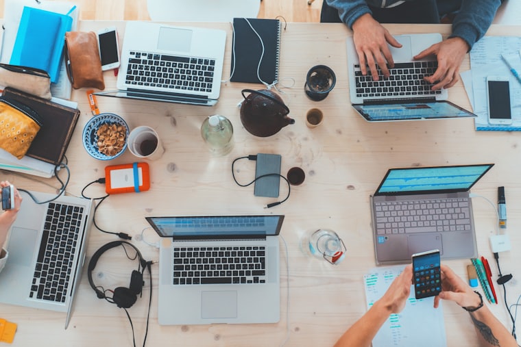 A team working together around a desk